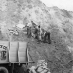 Men bagging dirt — used for sandbagging for the 1952 Flood.