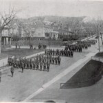 1921, High School Cadets in formation at 5th Ave. and 3rd Street.